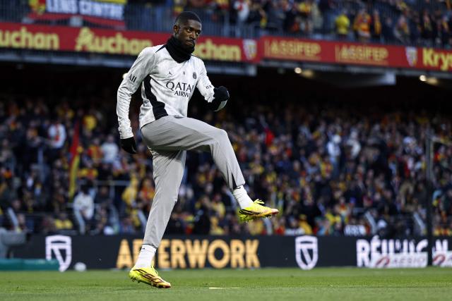 (FILES) PSG's French forward #10 Ousmane Dembele takes part in the warm-up ahead of the French L1 football match between RC Lens and Paris Saint-Germain (PSG) at the Stade Bollaert-Delelis stadium in Lens on May 13, 2026. Paris Saint-Germain forward and Ballon d'Or winner Ousmane Dembele is suffering from "muscle discomfort in his right calf" and will remain "under treatment" this week, the club announced on May 18, 2026, twelve days before the UEFA Champions League final against Arsenal. (Photo by SIMON WOHLFAHRT / AFP)