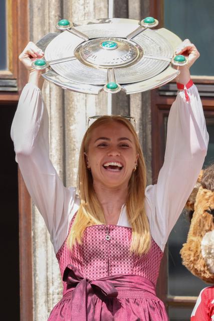 Bayern Munich's Icelandic defender #04 Glodis Viggosdottir  celebrates with the Bundesliga trophy on the balcony of the City Hall at Marienplatz in Munich, southern Germany on May 18, 2026. (Photo by Alexandra BEIER / AFP) / ALTERNATIVE CROP