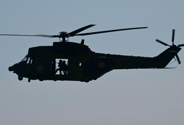 An helicopter of the NATO Special Operations Forces is seen during the Trojan Footprint 2026 (TFP26) military exercise at sea in Constanta, south-eastern Romania, on May 18, 2026. TFP26 is the largest U.S. Special Operations Forces (SOF) led exercise in Europe, bringing together approximately 1,000 U.S. service members and 2,000 SOF personnel from 23 NATO Allies and partner nations. Running through mid-May, the exercise spans multiple Eastern European countries including Greece and Georgia where it encompasses the "Black Sea Gateway 2026" land and maritime operations. (Photo by Daniel MIHAILESCU / AFP)