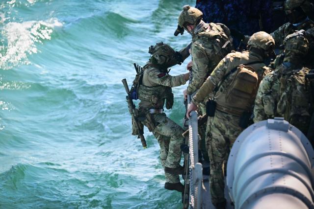 Officers of the NATO Special Operations Forces are seen during the Trojan Footprint 2026 (TFP26) military exercise at sea in Constanta, south-eastern Romania, on May 18, 2026. TFP26 is the largest U.S. Special Operations Forces (SOF) led exercise in Europe, bringing together approximately 1,000 U.S. service members and 2,000 SOF personnel from 23 NATO Allies and partner nations. Running through mid-May, the exercise spans multiple Eastern European countries including Greece and Georgia where it encompasses the "Black Sea Gateway 2026" land and maritime operations. (Photo by Daniel MIHAILESCU / AFP)