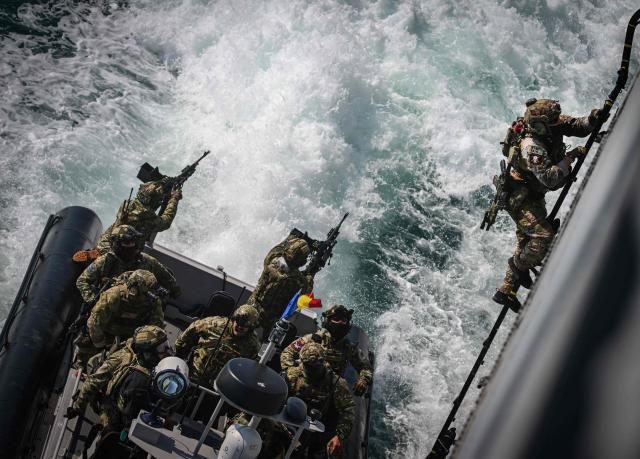 Officers of the NATO Special Operations Forces are seen during the Trojan Footprint 2026 (TFP26) military exercise at sea in Constanta, south-eastern Romania, on May 18, 2026. TFP26 is the largest U.S. Special Operations Forces (SOF) led exercise in Europe, bringing together approximately 1,000 U.S. service members and 2,000 SOF personnel from 23 NATO Allies and partner nations. Running through mid-May, the exercise spans multiple Eastern European countries including Greece and Georgia where it encompasses the "Black Sea Gateway 2026" land and maritime operations. (Photo by Daniel MIHAILESCU / AFP)