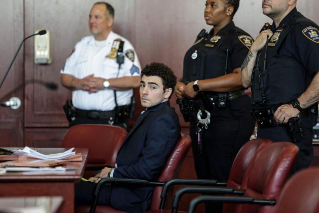 Luigi Mangione, accused of the murder of United Healthcare CEO Brian Thompson, attends a court hearing to rule on the admissibility of evidence and setting of trial date in New York, on May 18, 2026. (Photo by Jeenah Moon / POOL / AFP)