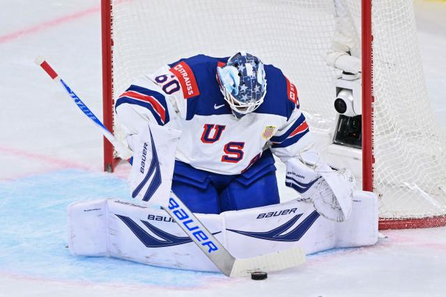 USA's goalkeeper #60 Joseph Woll dives to block the puck  during the IIHF Ice Hockey Men's World Championship first round group A match between Finland and USA at the Swiss Life Arena in Zurich on May 18, 2026. (Photo by SEBASTIEN BOZON / AFP)