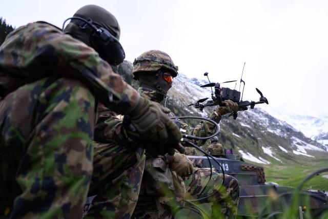 A Swiss soldier controls an FPV drone during a demonstration of procedures for deploying mini-drones in combat situations by the Swiss Army's Drones and Robotics Defence Competence Centre at the Wichlen shooting range near Glarus-Sud on May 18, 2026. (Photo by HAROLD CUNNINGHAM / AFP)