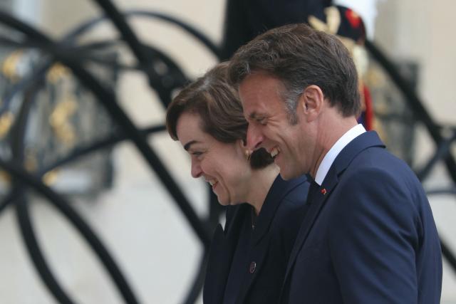 France's President Emmanuel Macron (R) reacts as he greets the Premier of Quebec Christine Frechette as she arrives prior to their meeting at the Elysee Presidential Palace in Paris on May 18, 2026. (Photo by Alain JOCARD / AFP)