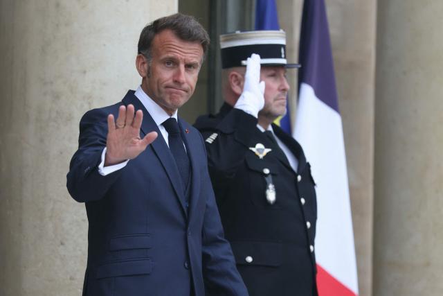 France's President Emmanuel Macron (L) gestures as he awaits the Premier of Quebec prior to their meeting at the Elysee Presidential Palace in Paris on May 18, 2026. (Photo by Alain JOCARD / AFP)