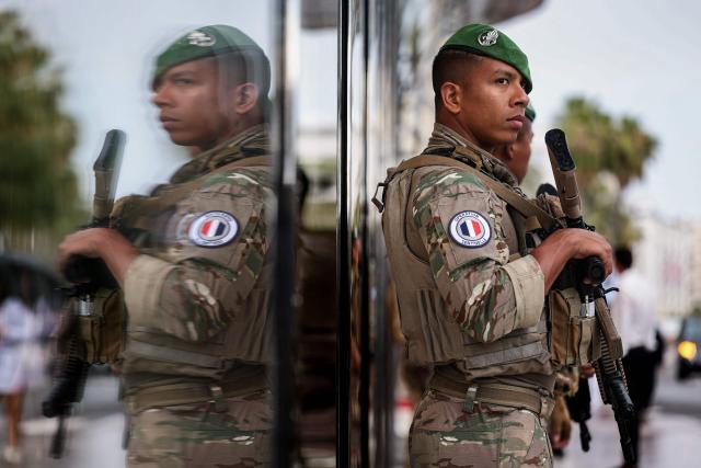 A member of French military Sentinelle Operation stands guard on the Boulevard de la Croisette on the sidelines of the 79th edition of the Cannes Film Festival in Cannes, southern France, on May 18, 2026. (Photo by SAMEER AL-DOUMY / AFP)