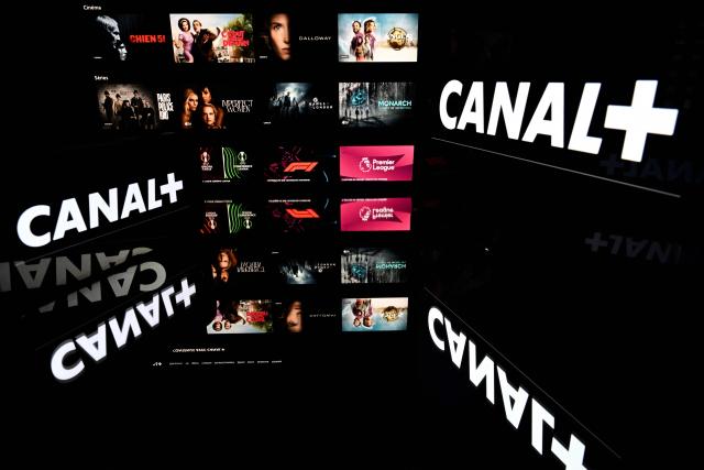 This illustration photograph shows screens displaying the logo of the French private television channel Canal Plus (Canal+) with the backdrop of its online streaming platform "MyCanal" in Toulouse, south-western France, on May 18, 2026. (Photo by Lionel BONAVENTURE / AFP)