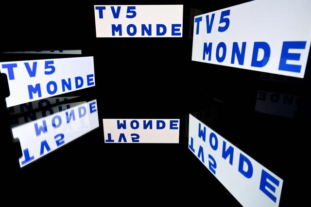 This illustration photograph shows screens displaying the logo of the international French television channel TV5Monde in Toulouse, south-western France, on May 18, 2026. (Photo by Lionel BONAVENTURE / AFP)