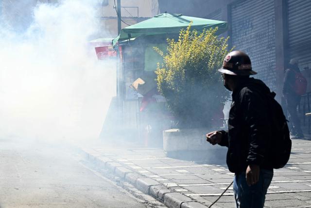 Miners clash with riot police during a protest demanding the resignation of Bolivian President Rodrigo Paz, in La Paz, on May 18, 2026. Bolivians have taken to the streets for the past two weeks, blocking roads into La Paz and disrupting deliveries of food, medicine and other goods to the seat of government, while demanding higher wages, economic relief and the resignation of centre-right President Rodrigo Paz amid a severe economic crisis. (Photo by AIZAR RALDES / AFP)
