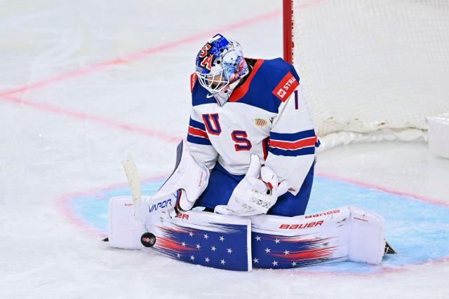 USA's goalkeeper #01 Devin Cooley dives for the puck  during the IIHF Ice Hockey Men's World Championship first round group A match between Finland and USA at the Swiss Life Arena in Zurich on May 18, 2026. (Photo by SEBASTIEN BOZON / AFP)