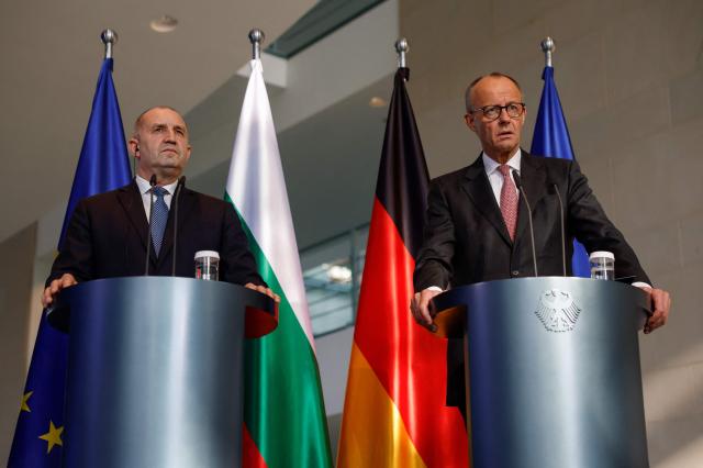 German Chancellor Friedrich Merz (R) and Bulgaria's Prime Minister Roman Radev address a press conference after talks at the Chancellery in Berlin on May 18, 2026. (Photo by Odd ANDERSEN / AFP)