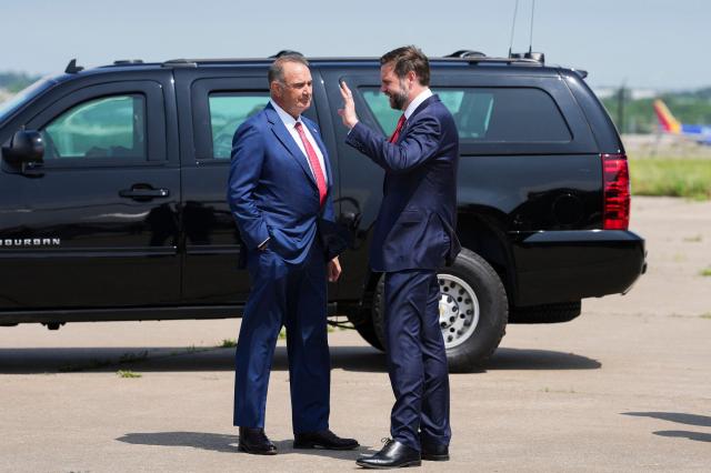 Missouri Governor Mike Kehoe welcomes US Vice President JD Vance as he arrives at Kansas City International Airport in Kansas City, Missouri, on May 18, 2026. (Photo by Eric Lee / POOL / AFP)
