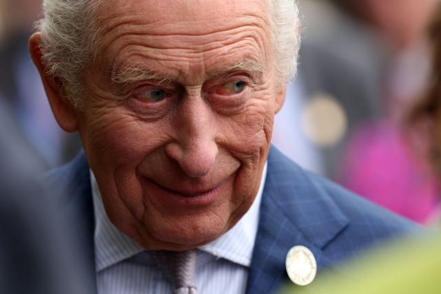 Britain's King Charles III reacts during a visit to 2026 RHS Chelsea Flower Show in London on May 18, 2026. (Photo by Adrian Dennis / POOL / AFP)