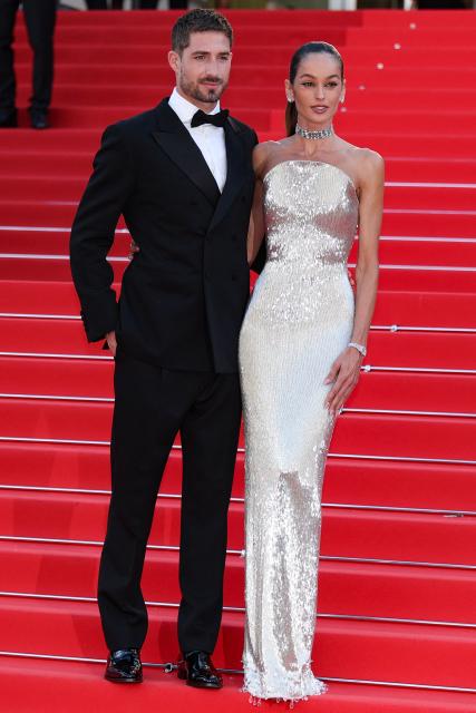 Paris FC's German goalkeeper Kevin Trapp and Brazilian model Izabel Goulart arrive for the screening of the film "Fjord" at the 79th edition of the Cannes Film Festival in Cannes, southern France on May 18, 2026. (Photo by Sameer AL-DOUMY / AFP)