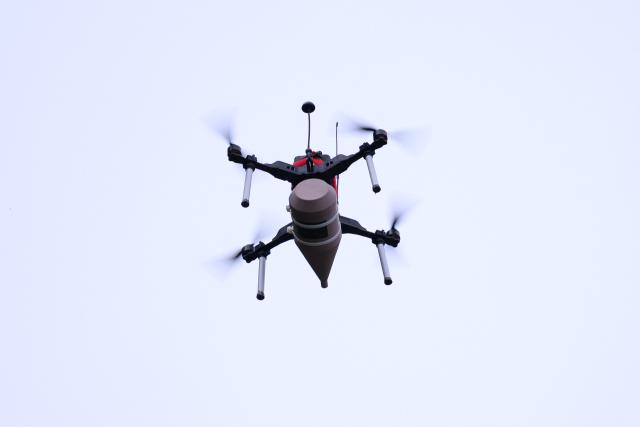 An FPV drone flies during a demonstration of procedures for deploying mini-drones in combat situations by the Swiss Army's Drones and Robotics Defence Competence Centre at the Wichlen shooting range near Glarus-Sud on May 18, 2026. (Photo by HAROLD CUNNINGHAM / AFP)