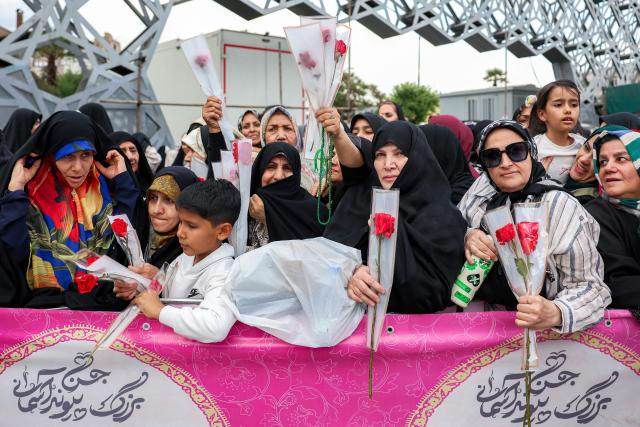 Revellers attend a public mass wedding ceremony at Imam Hossein Square in Tehran on May 18, 2026. Iran said on May 18 that it had responded to a new US proposal aimed at ending the war, adding that diplomatic exchanges continue despite Iranian media reports describing Washington's demands as excessive. Washington and Tehran have been swapping proposals in an effort to end the conflict which the US and Israel launched on February 28, but they have held only a single round of talks despite a fragile ceasefire. (Photo by AFP) / 