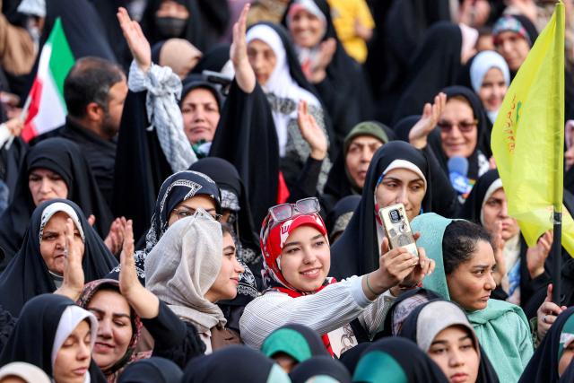 Revellers attend a public mass wedding ceremony at Imam Hossein Square in Tehran on May 18, 2026. Iran said on May 18 that it had responded to a new US proposal aimed at ending the war, adding that diplomatic exchanges continue despite Iranian media reports describing Washington's demands as excessive. Washington and Tehran have been swapping proposals in an effort to end the conflict which the US and Israel launched on February 28, but they have held only a single round of talks despite a fragile ceasefire. (Photo by AFP) / 