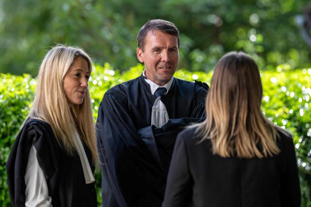 Defense lawyers Arnaud Julien (C) and Charlotte Barriol (L) are pictured during a break in the trial of Guillaume B., who is accused of multiple acts of abuse against his partner over seven years, from 2015 to 2020, at the Alpes-de-Haute-Provence court in Digne-les-Bains, southeastern France, on May 18, 2026. The trial of Guillaume B., accused of subjecting his partner to seven years of abuse and rape accompanied by acts of torture, began on May 18, 2026 at the Assize Court in Digne-les-Bains (Alpes-de-Haute-Provence), where he faces a life sentence. (Photo by MIGUEL MEDINA / AFP)