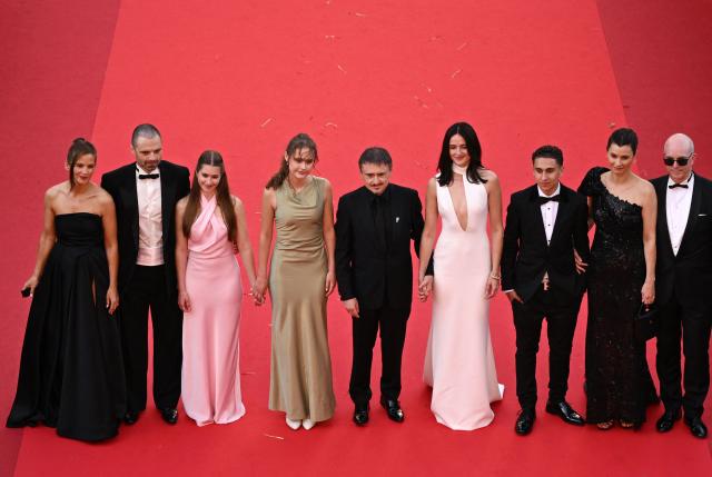 (From L) Swedish actress Lisa Carlehed, Romanian-US actor Sebastian Stan, Romanian actress Vanessa Ceban, Romanian director, screenwriter and producer Cristian Mungiu, Norwegian actress Renate Reinsve, Norwegian actor Jonathan Ciprian Breazu, Norwegian actress Lisa Loven Kongsli, Norwegian actor Markus Scarth Tonseth arrive for the screening of the film "Fjord" at the 79th edition of the Cannes Film Festival in Cannes, southern France on May 18, 2026. (Photo by Antonin THUILLIER / AFP)