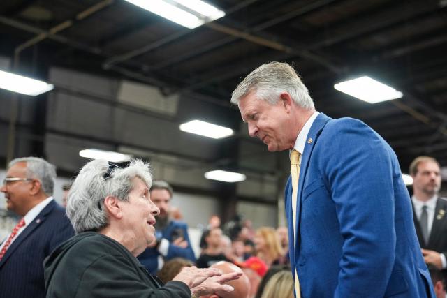 US Senator Roger Marshall, Republican of Missouri, interacts with a woman during an event with during an event with US Vice President JD Vance at Milbank Manufacturing Company in Kansas City, Missouri, on May 18, 2026. (Photo by Eric Lee / POOL / AFP)