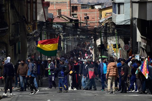Miners take part in a protest demanding the resignation of Bolivian President Rodrigo Paz, in La Paz, on May 18, 2026. Bolivians have taken to the streets for the past two weeks, blocking roads into La Paz and disrupting deliveries of food, medicine and other goods to the seat of government, while demanding higher wages, economic relief and the resignation of centre-right President Rodrigo Paz amid a severe economic crisis. (Photo by Jorge BERNAL / AFP)