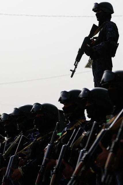 Security forces stand guard during a rally by supporters of the Iran-backed Houthi movement in solidarity with Lebanon, in Sanaa on May 18, 2026. Hezbollah drew Lebanon into the Middle East war on March 2 with rocket fire at Israel in retaliation for the killing of Iran's supreme leader in US-Israeli strikes days earlier. (Photo by Mohammed HUWAIS / AFP)