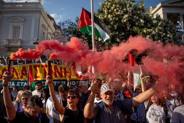 People hold a protest against the recent interception of the Global Solidarity Flotilla by the Israeli Navy near Cyprus outside the Ministry of Foreign Affairs in Athens on May 18, 2026. Israeli forces intercepted a Gaza-bound aid flotilla on May 18, 2026 after it sailed from Turkey the previous week, with Prime Minister Benjamin Netanyahu denouncing the mission as a "malicious scheme" intended to support Hamas, as the Global Sumud Flotilla vessels mark the latest in a series of attempts by activists to breach Israel's blockade of the Palestinian territory, with the last convoy intercepted by Israeli forces the previous month. (Photo by Aggelos NAKKAS / AFP)