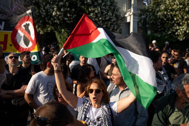 People hold a protest against the recent interception of the Global Solidarity Flotilla by the Israeli Navy near Cyprus outside the Ministry of Foreign Affairs in Athens on May 18, 2026. Israeli forces intercepted a Gaza-bound aid flotilla on May 18, 2026 after it sailed from Turkey the previous week, with Prime Minister Benjamin Netanyahu denouncing the mission as a "malicious scheme" intended to support Hamas, as the Global Sumud Flotilla vessels mark the latest in a series of attempts by activists to breach Israel's blockade of the Palestinian territory, with the last convoy intercepted by Israeli forces the previous month. (Photo by Aggelos NAKKAS / AFP)