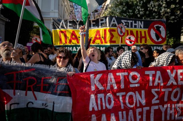 People hold a protest against the recent interception of the Global Solidarity Flotilla by the Israeli Navy near Cyprus outside the Ministry of Foreign Affairs in Athens on May 18, 2026. Israeli forces intercepted a Gaza-bound aid flotilla on May 18, 2026 after it sailed from Turkey the previous week, with Prime Minister Benjamin Netanyahu denouncing the mission as a "malicious scheme" intended to support Hamas, as the Global Sumud Flotilla vessels mark the latest in a series of attempts by activists to breach Israel's blockade of the Palestinian territory, with the last convoy intercepted by Israeli forces the previous month. (Photo by Aggelos NAKKAS / AFP)