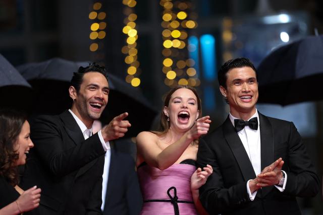 (From L) Mexican actor Diego Calva, US actress Kristine Froseth and US actor Charles Melton arrive for the screening of the film "Her Private Hell" at the 79th edition of the Cannes Film Festival in Cannes, southern France on May 18, 2026. (Photo by Sameer AL-DOUMY / AFP)
