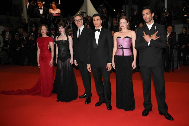 (From L) US actress Havana Rose Liu, US actress Sophie Thatcher, Danish director and screenwriter Nicolas Winding Refn, US actor Charles Melton, US actress Kristine Froseth and Mexican actor Diego Calva arrive for the screening of the film "Her Private Hell" at the 79th edition of the Cannes Film Festival in Cannes, southern France on May 18, 2026. (Photo by Olivier CHASSIGNOLE / AFP)