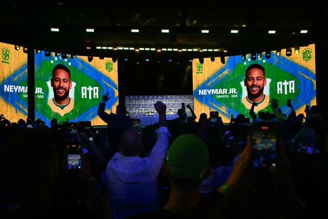 People celebrate after the announcement of Brazilian footballer Neymar Jr. during an event to announce Brazil's squad for the 2026 FIFA World Cup at the Museum of Tomorrow, in downtown Rio de Janeiro, Brazil, on May 18, 2026. (Photo by MAURO PIMENTEL / AFP)