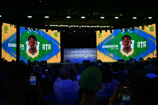 An image of Brazilian footballer Endrick is projected onto two giant screens during an event to announce Brazil's squad for the 2026 FIFA World Cup at the Museum of Tomorrow, in downtown Rio de Janeiro, Brazil, on May 18, 2026. (Photo by MAURO PIMENTEL / AFP)