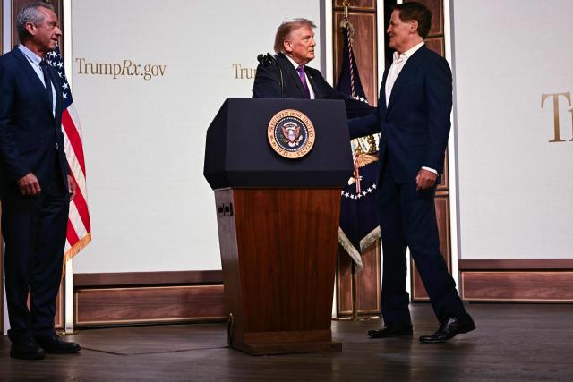 US President Donald Trump greets US businessman Mark Cuban during a healthcare affordability event in the South Court Auditorium of The White House in Washington, DC, on May 18, 2026. (Photo by Kent NISHIMURA / AFP)