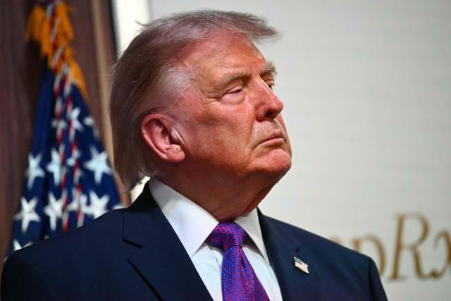 US President Donald Trump listens during a healthcare affordability event in the South Court Auditorium of The White House in Washington, DC, on May 18, 2026. (Photo by Kent NISHIMURA / AFP)