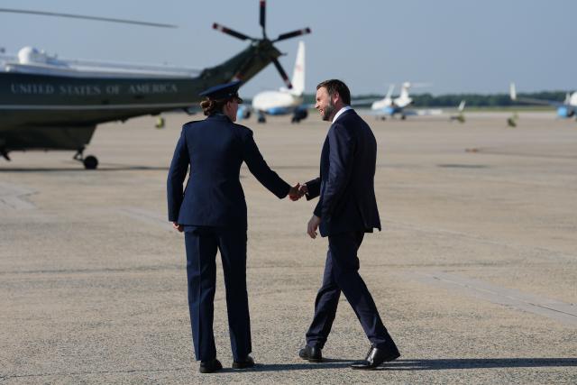 US Vice President JD Vance walks towards Marine Two after disembarking Air Force Two, following his visit to Kansas City, at Joint Base Andrews, Maryland, on May 18, 2026. (Photo by Eric Lee / POOL / AFP)