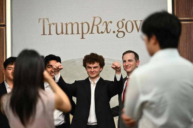 Engineer Edward Coristine takes photos after a healthcare affordability event in the South Court Auditorium of The White House in Washington, DC, on May 18, 2026. (Photo by Kent NISHIMURA / AFP)