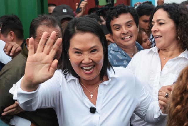 Peru's presidential candidate for the Fuerza Popular party, Keiko Fujimori, greets supporters during a campaign event at the Eden market in Callao, Peru on May 18, 2026. Right-wing candidate Keiko Fujimori and left-wing candidate Roberto Sanchez will face off on June 7 in Peru's presidential runoff, the electoral authority confirmed on May 17 when it officially proclaimed the results. (Photo by Connie FRANCE / AFP)