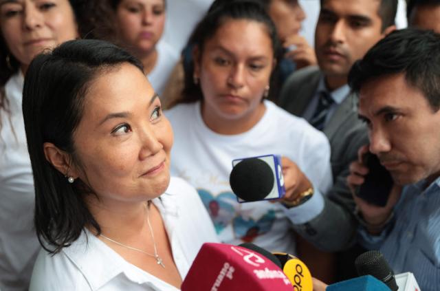Peru's presidential candidate for the Fuerza Popular party, Keiko Fujimori, gestures as she speaks with the press during a campaign event at the Eden market in Callao, Peru on May 18, 2026. Right-wing candidate Keiko Fujimori and left-wing candidate Roberto Sanchez will face off on June 7 in Peru's presidential runoff, the electoral authority confirmed on May 17 when it officially proclaimed the results. (Photo by Connie FRANCE / AFP)