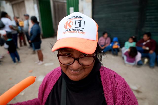 A supporter of Peru's presidential candidate Keiko Fujimori of the Fuerza Popular party attends a campaign event at the Eden market in Callao, Peru on May 18, 2026. Right-wing candidate Keiko Fujimori and left-wing candidate Roberto Sanchez will face off on June 7 in Peru's presidential runoff, the electoral authority confirmed on May 17 when it officially proclaimed the results. (Photo by Connie FRANCE / AFP)