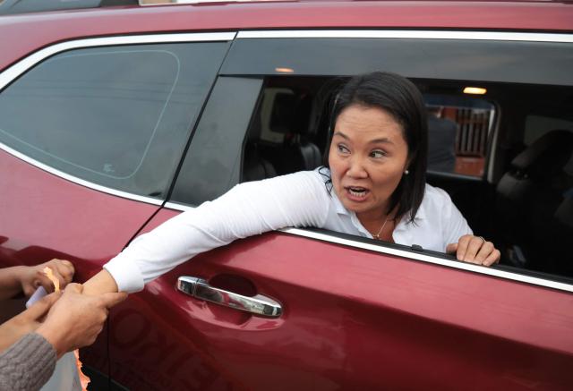 Peru's presidential candidate for the Fuerza Popular party, Keiko Fujimori, greets supporters during a campaign event at the Eden market in Callao, Peru on May 18, 2026. Right-wing candidate Keiko Fujimori and left-wing candidate Roberto Sanchez will face off on June 7 in Peru's presidential runoff, the electoral authority confirmed on May 17 when it officially proclaimed the results. (Photo by Connie FRANCE / AFP)