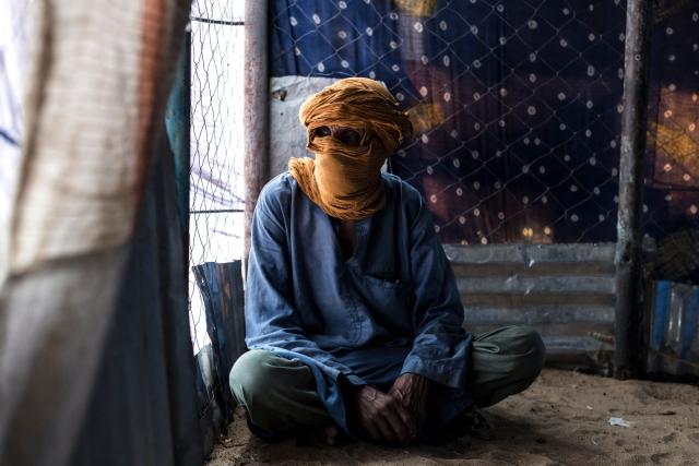 A witness poses for a portrait at a makeshift camp near the Mauritanian border with Mali, in the Hodh Ech Chargui region, on April 29, 2026. Nedoune was kidnapped and tortured by Russian mercenaries two years ago as they questioned him. Having come to power through a coup d’йtat in 2020 on the promise of restoring security throughout the country, the junta led by General Assimi Goпta began turning as early as 2021 to the services of the Russian Wagner militia.Since becoming Africa Corps, now directly under the authority of the Russian Ministry of Defense, the group’s abuses have been widely documented by human rights organizations. A dozen Malian refugees have testified to AFP from Mauritania about the violence committed against civilians by the Malian army and the Russian mercenaries supporting it in their fight against jihadism: abductions, torture, executions, and rape. (Photo by PATRICK MEINHARDT / AFP)