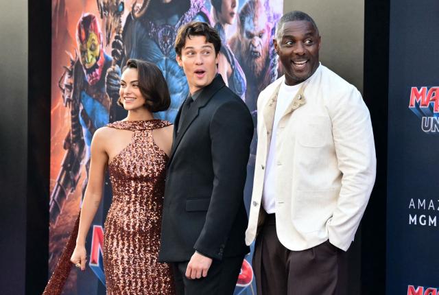 US actress Camila Mendes (L), British actor Nicholas Galitzine (C) and British actor Idris Elba (R) attend the premiere of Amazon MGM Studios' "Masters of the Universe" at TCL Chinese Theatre in Hollywood, California, on May 18, 2026. (Photo by Frederic J. Brown / AFP) / ALTERNATE CROP