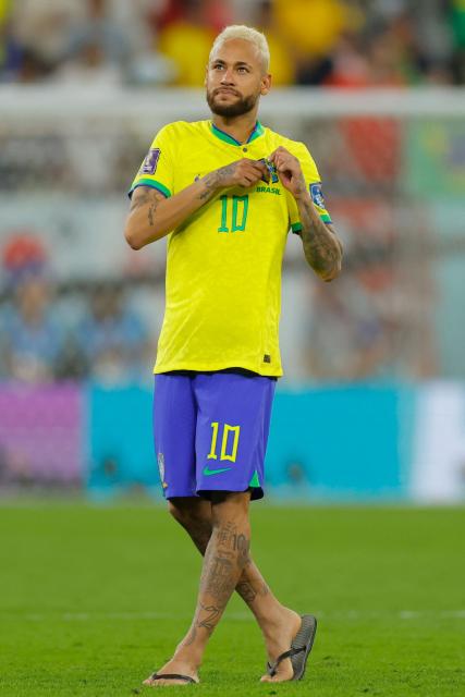 (FILES) Brazil's forward #10 Neymar celebrates after his team won the Qatar 2022 World Cup round of 16 football match between Brazil and South Korea at Stadium 974 in Doha on December 5, 2022. Brazil superstar Neymar was handed a dramatic recall to the country's World Cup squad on May 18, 2026, returning to the national team after a near three-year absence. (Photo by Odd ANDERSEN / AFP)