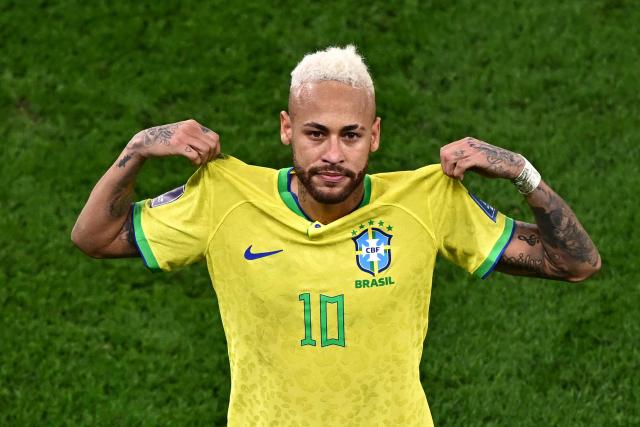 (FILES) Brazil's forward #10 Neymar celebrates scoring his team's first goal during the Qatar 2022 World Cup quarter-final football match between Croatia and Brazil at Education City Stadium in Al-Rayyan, west of Doha, on December 9, 2022. Brazil superstar Neymar was handed a dramatic recall to the country's World Cup squad on May 18, 2026, returning to the national team after a near three-year absence. (Photo by Anne-Christine POUJOULAT / AFP)