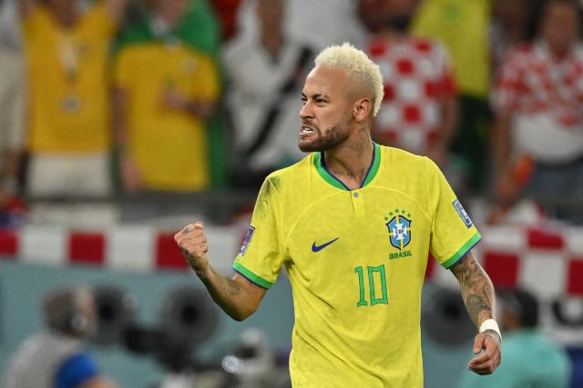 (FILES) Brazil's forward #10 Neymar celebrates after he scored his team's first goal during the Qatar 2022 World Cup quarter-final football match between Croatia and Brazil at Education City Stadium in Al-Rayyan, west of Doha, on December 9, 2022. Brazil superstar Neymar was handed a dramatic recall to the country's World Cup squad on May 18, 2026, returning to the national team after a near three-year absence. (Photo by NELSON ALMEIDA / AFP)