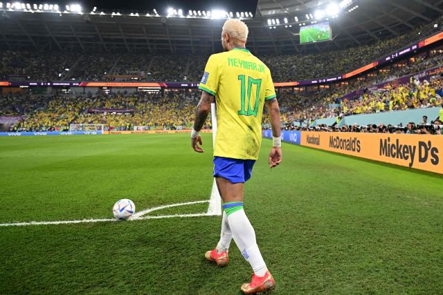 (FILES) Brazil's forward #10 Neymar prepares to shoot a corner kick during the Qatar 2022 World Cup round of 16 football match between Brazil and South Korea at Stadium 974 in Doha on December 5, 2022. Brazil superstar Neymar was handed a dramatic recall to the country's World Cup squad on May 18, 2026, returning to the national team after a near three-year absence. (Photo by MANAN VATSYAYANA / AFP)