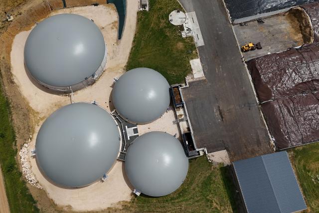This aerial photograph shows a view of concrete vats at the biomethane plant of Blajan, south-western France on May 18, 2026. The Blajan plant processes some 27,000 tonnes of biomass each year, and 20 MWh of biomethane are injected into the French natural gas providor (GRDF) network, equivalent to the consumption of a town of 12,000 inhabitants. (Photo by Pablo COZZAGLIO / AFP)