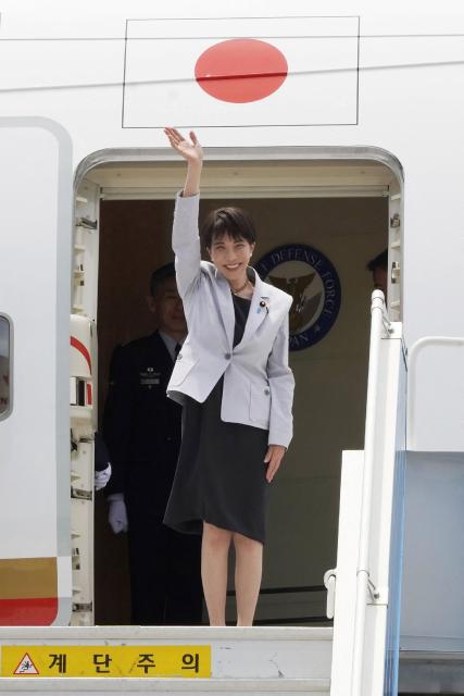 Japan's Prime Minister Sanae Takaichi waves as she leaves for a visit to South Korea from Haneda International Airport in Tokyo on May 19, 2026. (Photo by JIJI PRESS / AFP) / Japan OUT